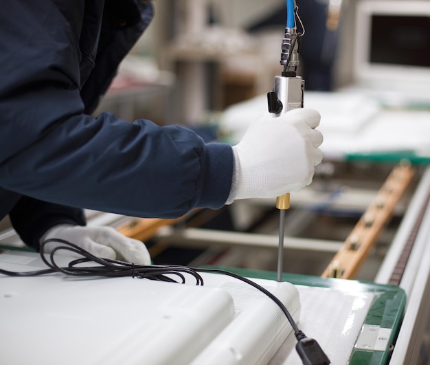 midsection of man working in factory