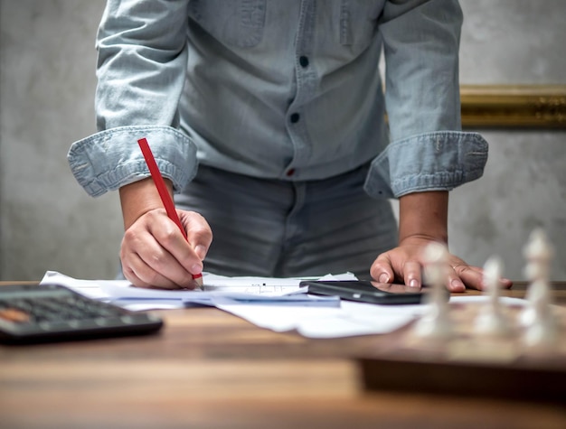 midsection of man working on table