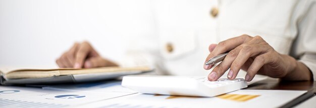 Midsection of man working on table