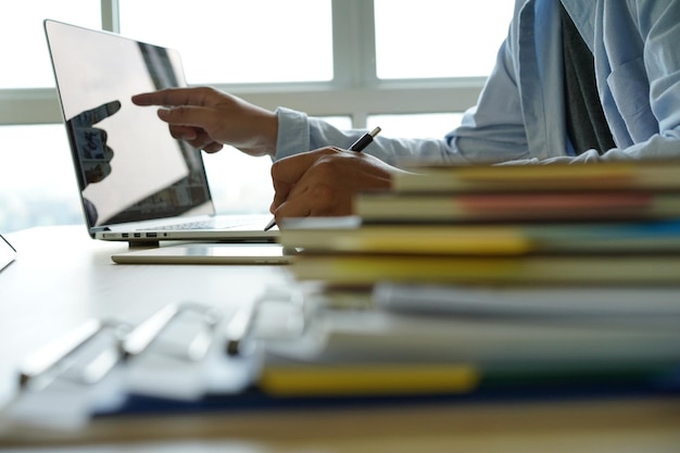 Midsection of man working on table