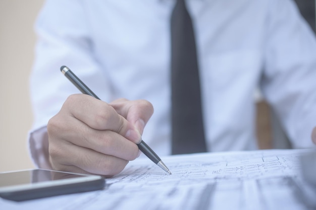 Midsection of man working on table