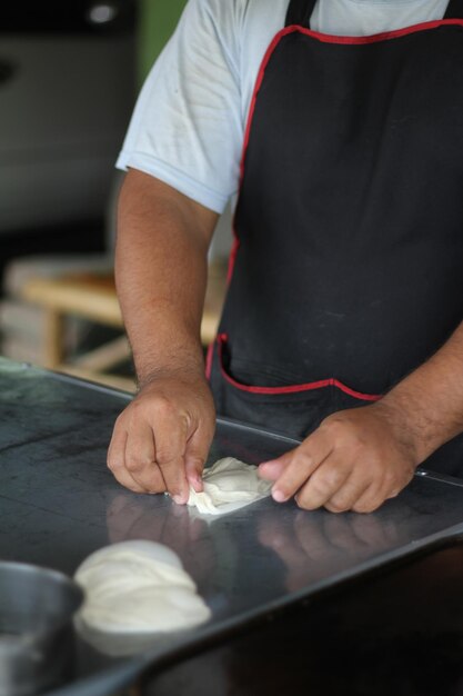 Midsection of man working on table