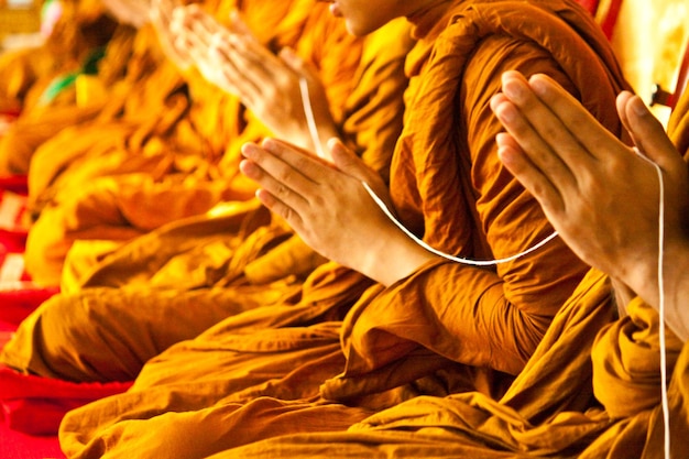 Photo midsection of monks praying