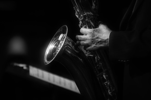 Photo midsection of musician playing saxophone