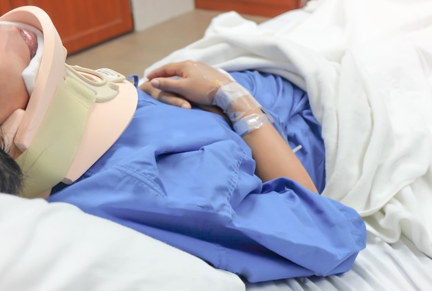 Midsection of patient lying on hospital bed