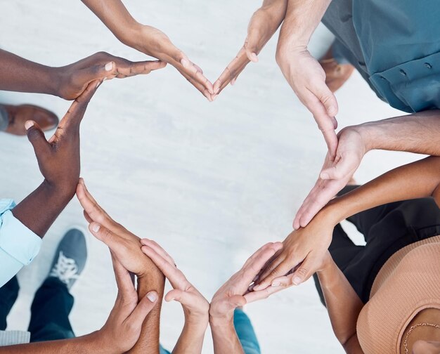 Photo midsection of people making heart shape