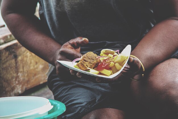 Photo midsection of person eating food