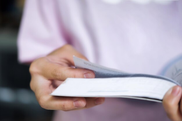 Photo midsection of person holding book