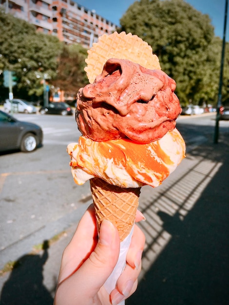 Photo midsection of person holding ice cream cone