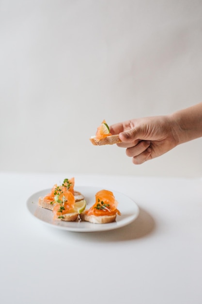 midsection of person holding ice cream in plate