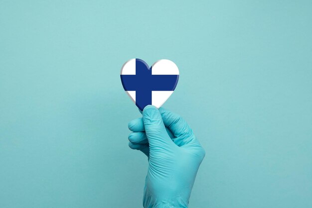 Midsection of person holding paper against blue background