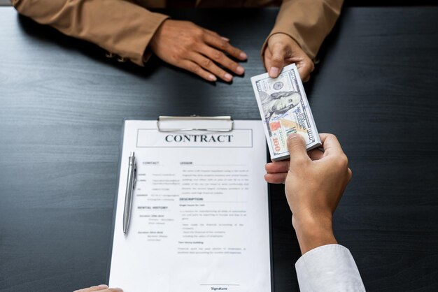 Midsection of person holding paper