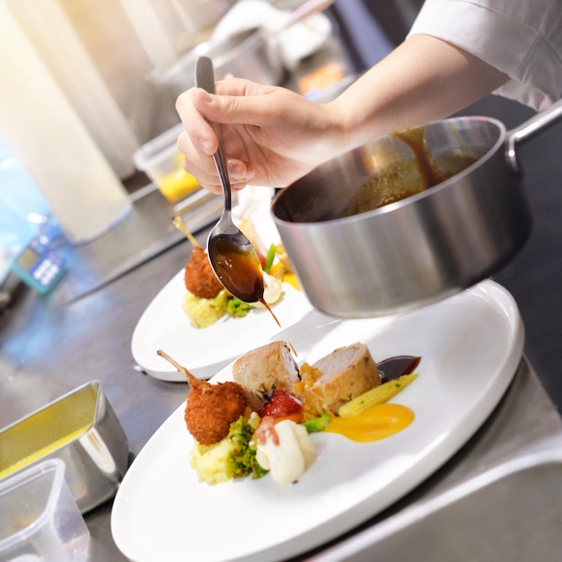 Photo midsection of person preparing food in restaurant