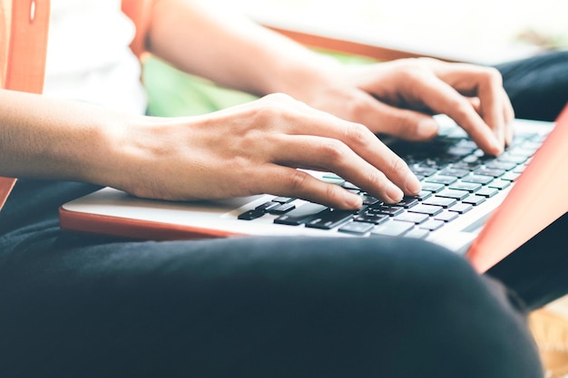 Photo midsection of person using laptop