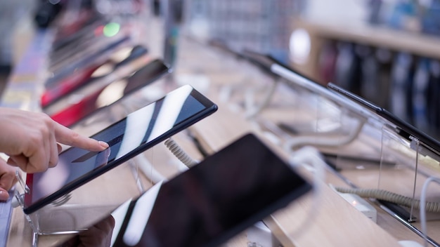 Photo midsection of person using mobile phone on table