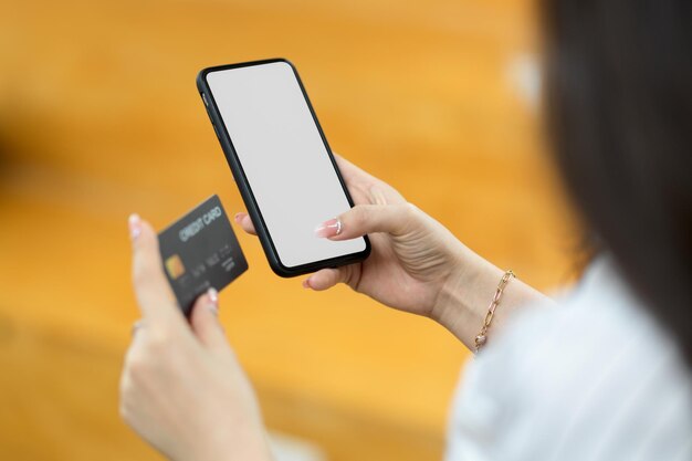 Midsection of person using mobile phone