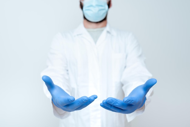 Midsection of person wearing mask against white background