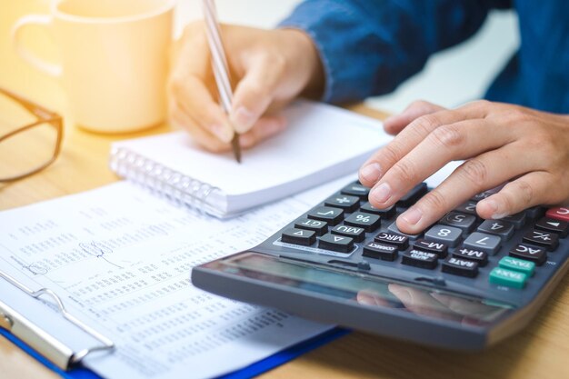 Midsection of person working on desk