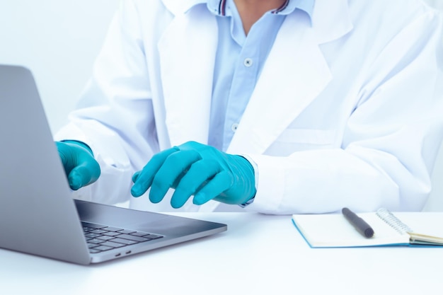 midsection of person working in laptop