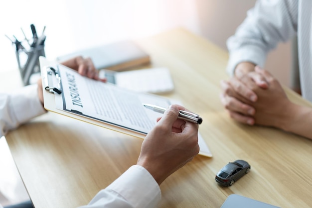 Midsection of real estate agent giving key