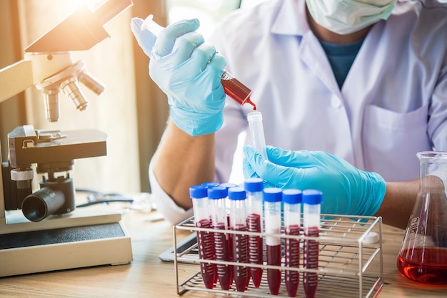 Midsection of scientist working in laboratory