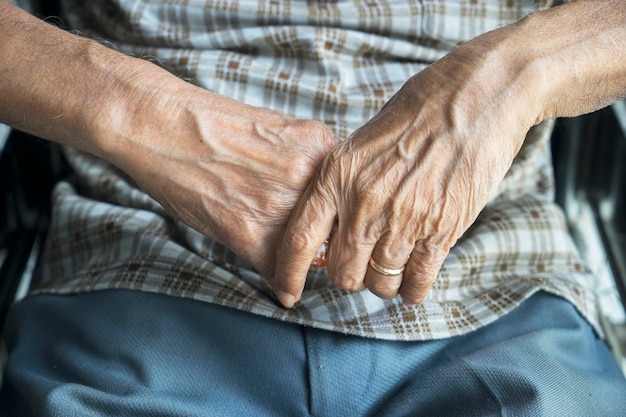 midsection of senior man wearing ring