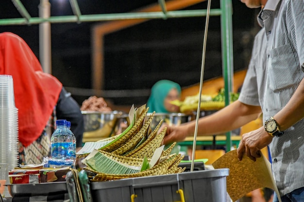 Photo midsection of standing at market stall