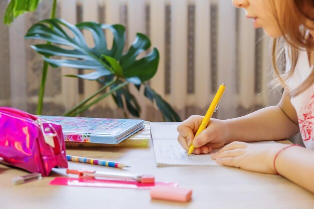 Photo midsection of woman drawing on book