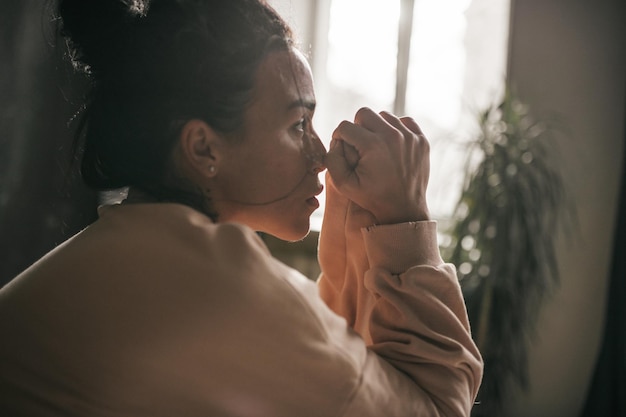 Photo midsection of woman drinking glass window