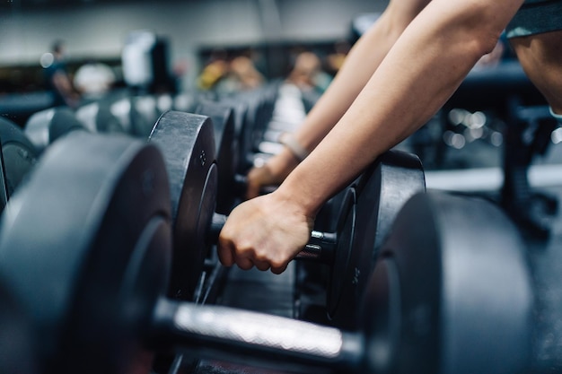 Midsection of woman exercising in gym