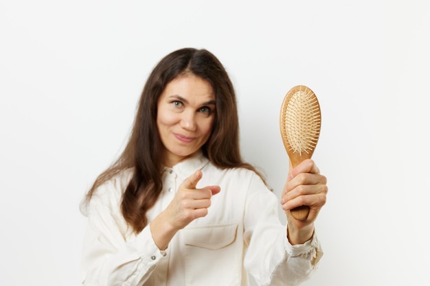 Midsection of woman holding apple against white background