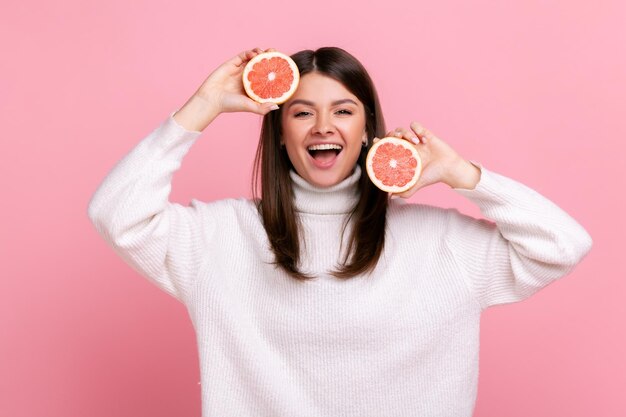 Midsection of woman holding apple