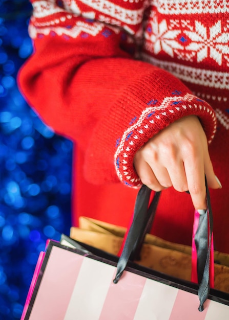 Photo midsection of woman holding bag during christmas