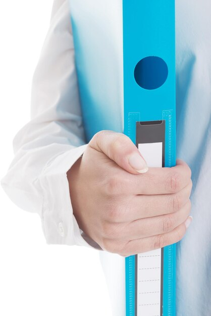 Midsection of woman holding blue folder against white background