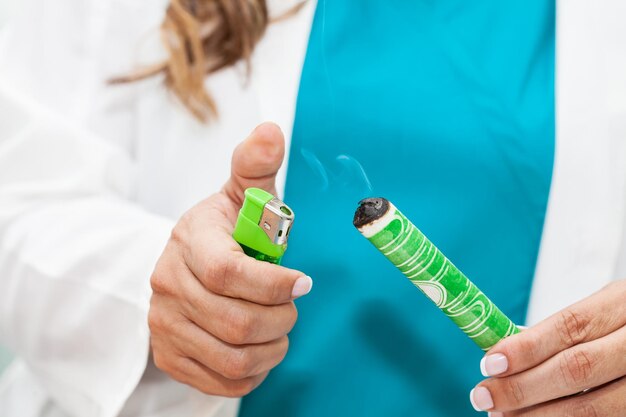 Photo midsection of woman holding burning stick