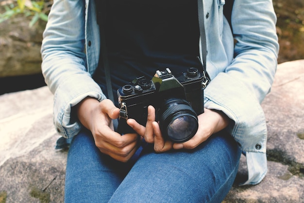 Photo midsection of woman holding camera