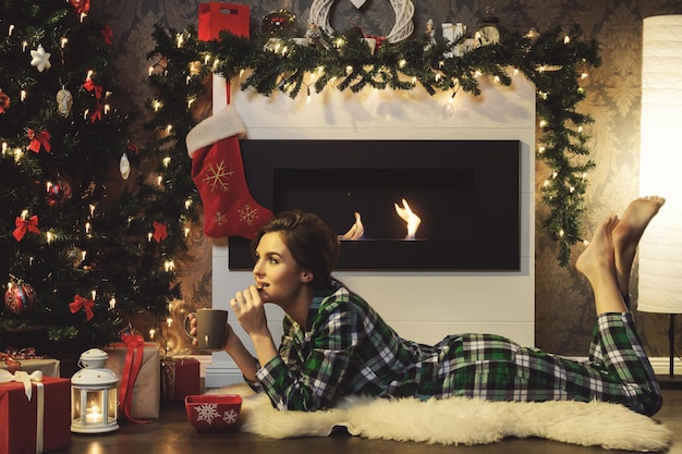 Photo midsection of woman holding christmas tree