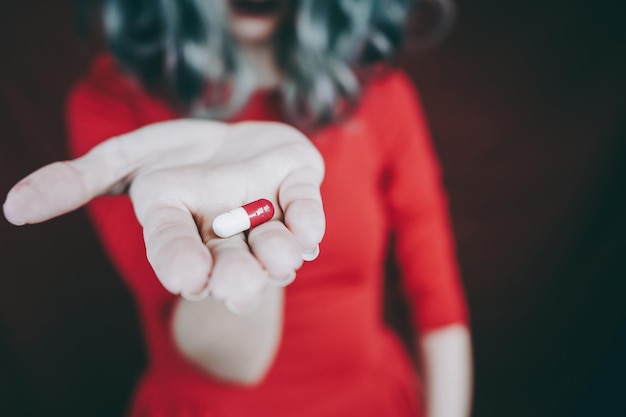 Midsection of woman holding cigarette