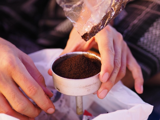 Midsection of woman holding coffee cup