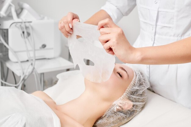 Photo midsection of woman holding dentures