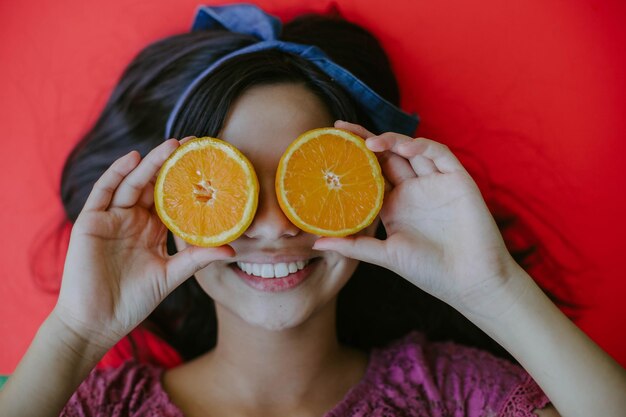 Photo midsection of woman holding fruits