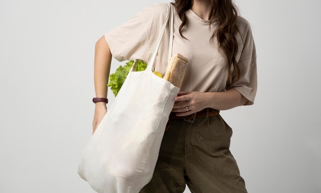 Photo midsection of woman holding gift against white background