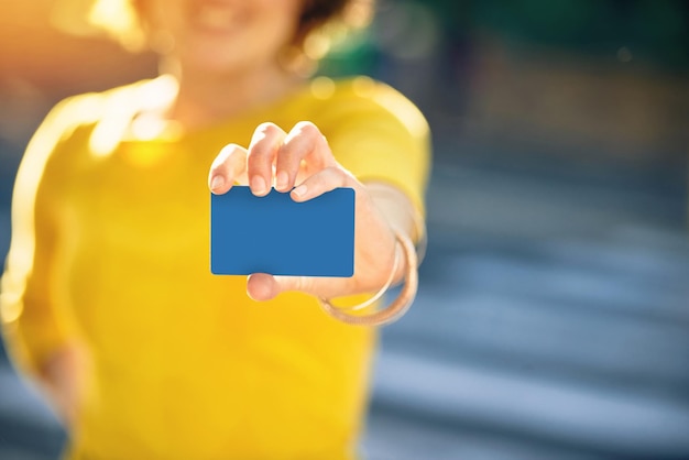 Midsection of woman holding heart shape