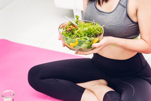 Midsection of woman holding ice cream