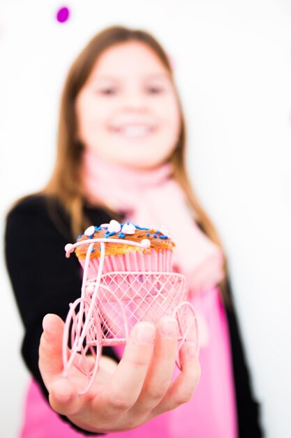 Midsection of woman holding ice cream