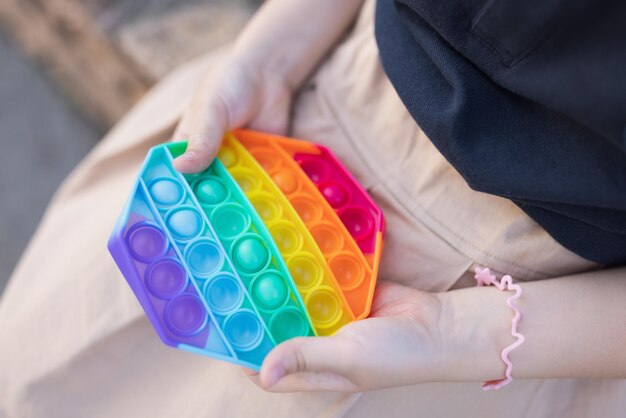 Midsection of woman holding multi colored paint