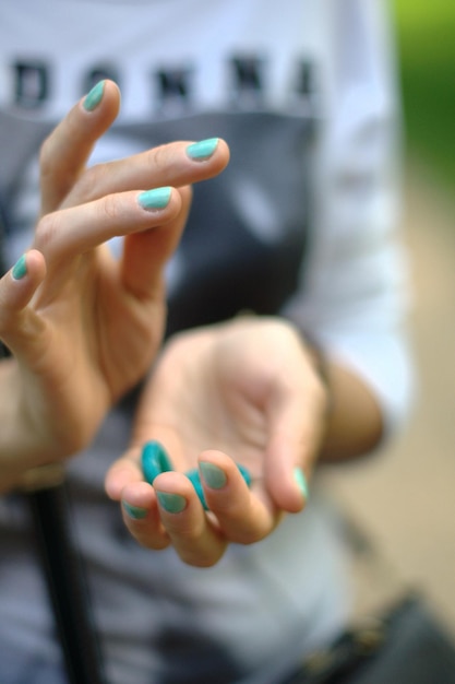 midsection of woman holding rings