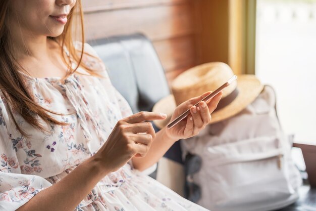 Photo midsection of woman holding while sitting at home