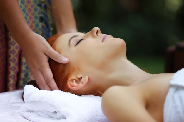 midsection of woman lying on hand