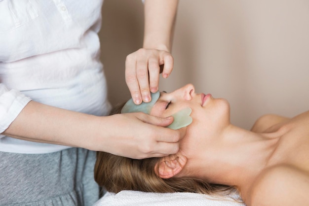 Midsection of woman lying on hands